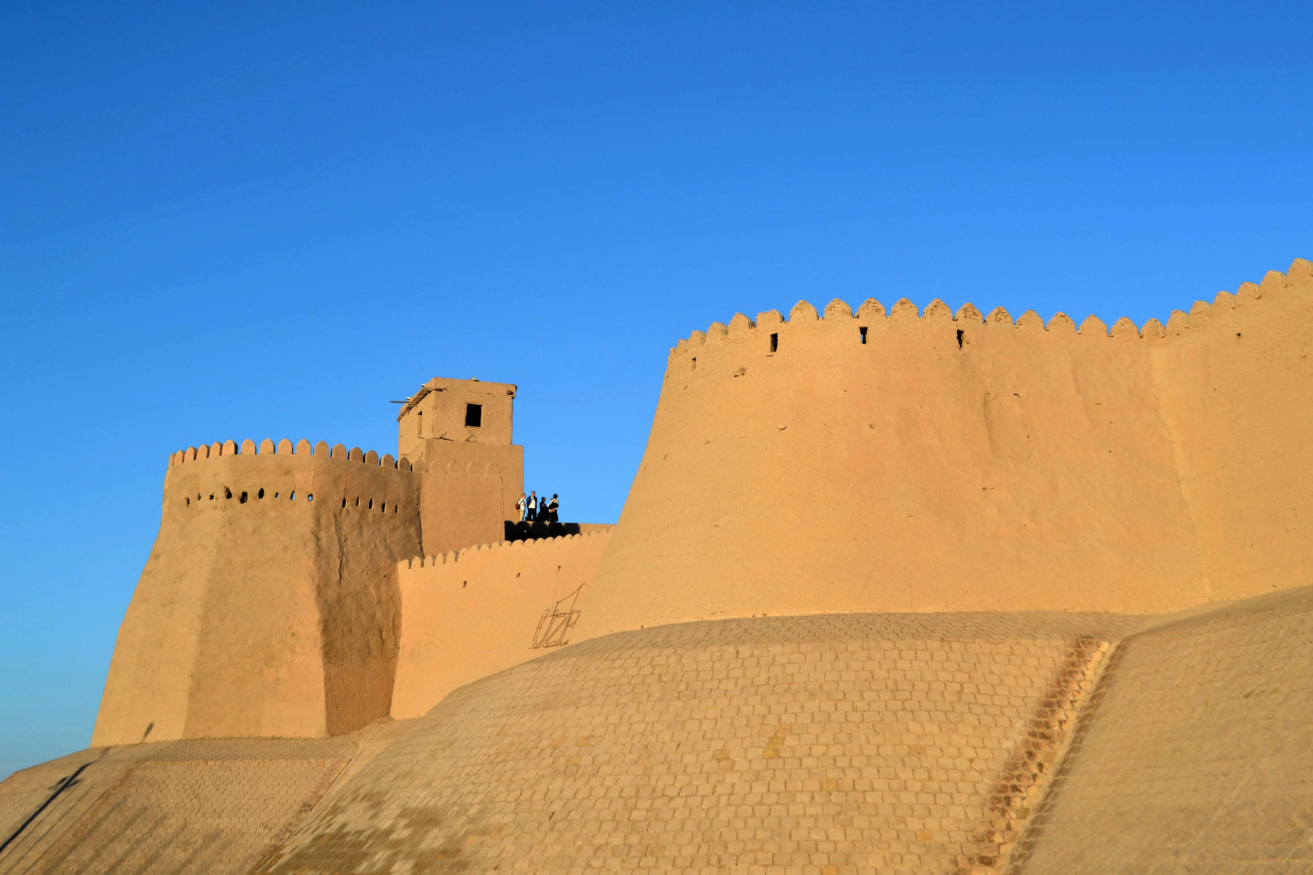 brown concrete building under blue sky during daytime